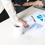 office-woman-hands-on-report